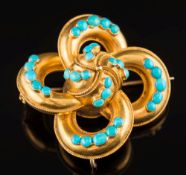 A 19th century gold and turquoise brooch: with 32 graduated turquoise, approximately 44mm across,