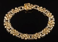 An 18ct gold two tone flexible-link bracelet: 19gms gross weight.