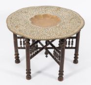An Indian 'School of Jaipur' brass top shaped circular tiffin table:,
