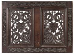 A carved and pierced oak armorial panel: in the 17th century manner,