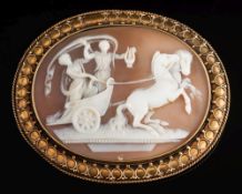 A late 19th century oval shell cameo brooch: depicting two classical female figures in a horse