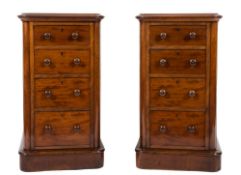 A pair of Victorian mahogany pedestal chests:, the tops each with a moulded edge,