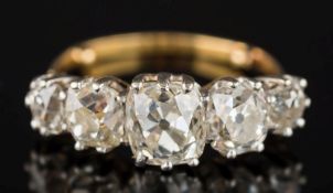 A 19th century graduated cushion-shaped diamond five-stone ring: the principal diamond