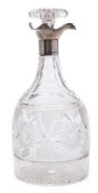 A George V silver mounted and clear glass decanter and stopper, maker Walter & Charles Sissons,