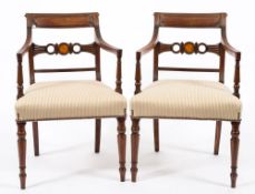 A pair of Regency mahogany elbow chairs:, with reeded backs,