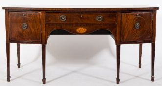 An early 19th Century mahogany and inlaid bow-fronted sideboard:,