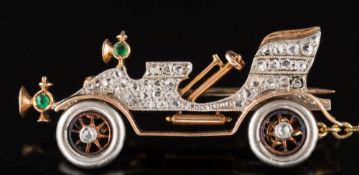 An Art Deco rose diamond and emerald-set vintage 'De Dion' style motor car brooch: pave-set with