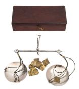 A pair of George IV polished steel and silver balance scales: the circular pans marked for George