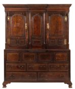 An 18th Century oak and chequer inlaid breakfront livery cupboard:,