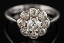 A diamond circular cluster ring: with circular, brilliant-cut diamonds,