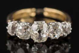 A graduated diamond five-stone ring: with oval and cushion-shaped old-cut diamonds,