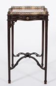 Edwards & Roberts A 19th Century carved mahogany urn table:, of serpentine outline,