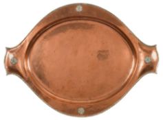An Arts and Crafts beaten copper and silver inlaid tray: of oval outline with Tudor rose medallions