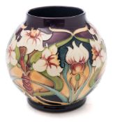 A Moorcroft pottery vase: of oviform tubelined in the Royal Gold pattern after the original by