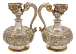 A pair of 19th century French silver-gilt ewers: of baluster form,