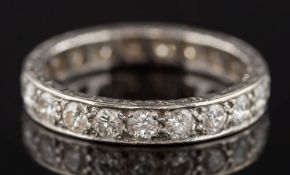 A diamond eternity ring: pave set with twenty one circular,