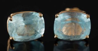 A pair of cushion-shaped aquamarine single-stone ear-studs: in four claw setting, stamped '14K', 2.