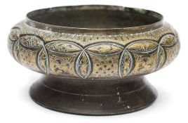 A Far Eastern brass betel nut bowl: chased and engraved with stylised foliage and knot motifs,