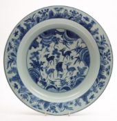 A Chinese blue and white porcelain shallow dish: the centre painted with five deer and a pair of