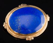 An oval lapis lazuli single stone brooch:, 44mm total length, 15gms gross weight.