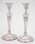 A pair of William IV silver candlesticks, all marks worn, maker possibly Samuel Roberts & Co,