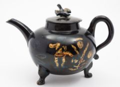 A 'Jackfield' black glazed pottery teapot and cover of Jacobite significance: of globular form with