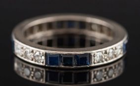 A sapphire and diamond eternity ring: with circular brilliant-cut diamonds estimated to weigh a