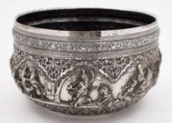 A large Indian silver bowl: of circular form, with banded decoration of mythical figures, hunters,