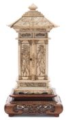A Japanese carved ivory model of a Jinja (Shinto shrine) of pagoda outline: the pitched roof with