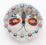 A Baccarat glass 'garlanded butterfly' paperweight: the centre with a large butterfly with black