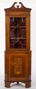 An Edwardian mahogany and marquetry standing corner display cabinet:, bordered with boxwood,