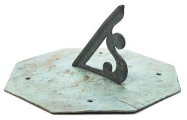 A 19th century octagonal engraved bronze sundial: inscribed ' The Silent I Speak' and the date