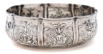 A middle Eastern silver dish: of shallow circular form,