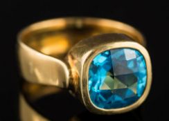 A cushion-shaped blue topaz single-stone ring: , the rose-cut topaz approximately 9.