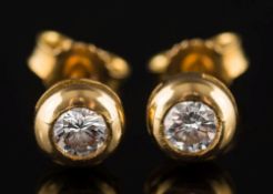 A pair of diamond single-stone ear-studs: each with a circular brilliant-cut diamond approximately