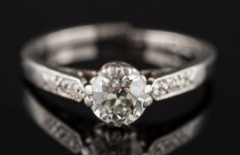 A diamond solitaire ring: the circular, old-cut diamond estimated to weigh 0.