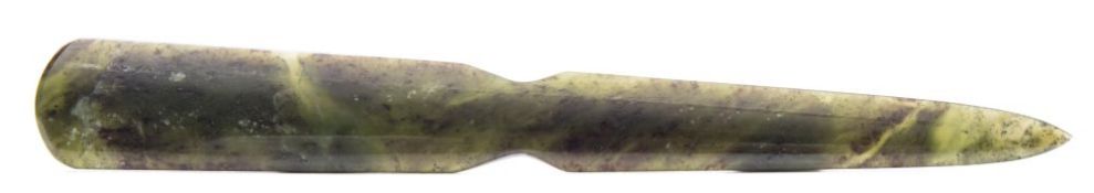 A jadeite paper knife/letter opener: the mottled green stone with black and cream inclusions,