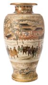 A Satsuma earthenware vase: of baluster form decorated with a central band depicting a procession