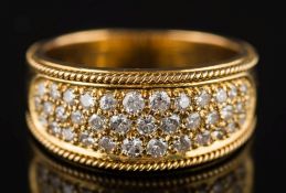 A diamond mounted cluster ring: pave-set with small circular diamonds estimated to weigh a total of