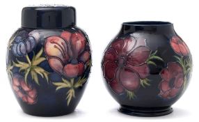 A Moorcroft pottery jar and cover and vase: both of oviform and tubelined in the Anemone pattern,