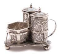 A Chinese silver three-piece cruet, maker WS possibly Woshing, Shanghai: on trefoil stand,