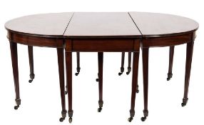 A 19th Century mahogany D-end dining table:, in three parts,