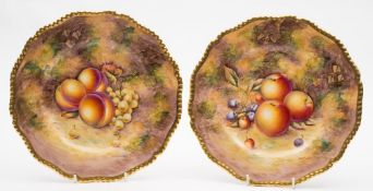 A pair of Royal Worcester fruit painted porcelain plates: painted by Sibley-Lewis with peaches,