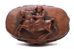 A Continental boxwood cartouche-shaped snuff box: the cover carved in high relief with the figure