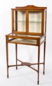 An Edwardian mahogany and inlaid bijouterie display cabinet:, crossbanded in satinwood,