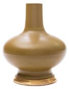 A Chinese porcelain bottle vase: decorated with a sage green glaze, 27 cm high [neck reduced,