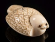 A Japanese carved ivory netsuke in the form of a sparrow: with folded wings and inset eyes, signed,