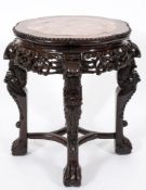 A Chinese carved hardwood jardiniere stand:, of lobed circular outline,