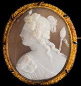 A gold and blue enamelled oval shell cameo portrait brooch: depicting a classical female figure