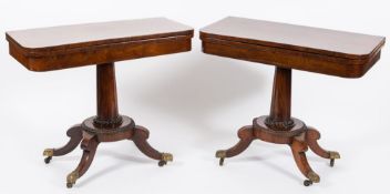 A pair of late Regency rosewood rectangular card tables:,